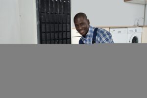 Technician Fixing Refrigerator